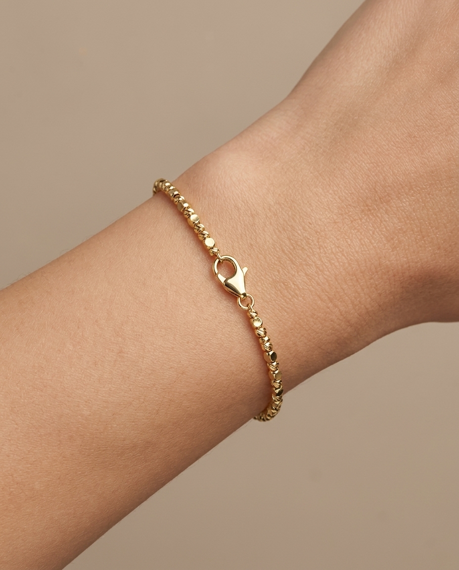 14KT Gold Diamond Cut Beads Bracelet on model