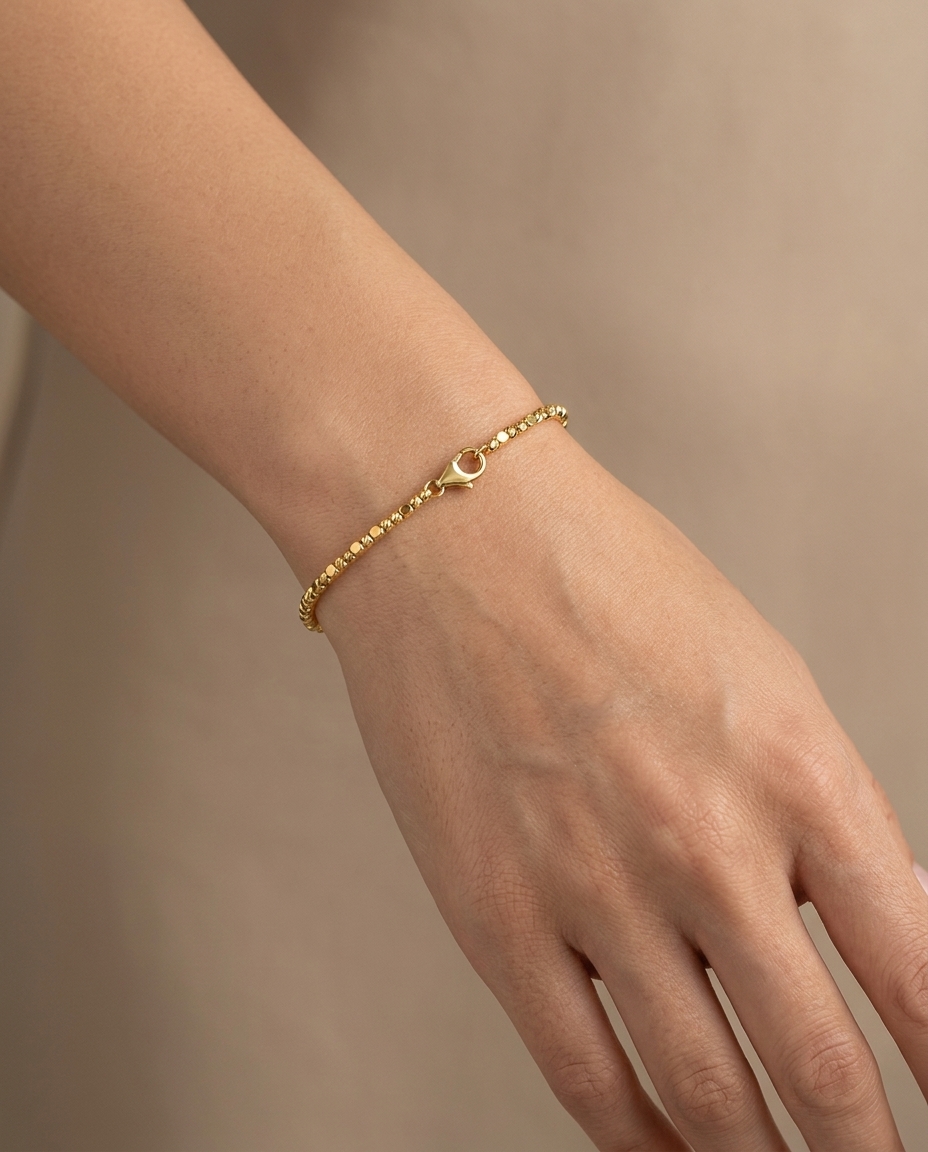 14KT Gold Diamond Cut Beads Bracelet on model