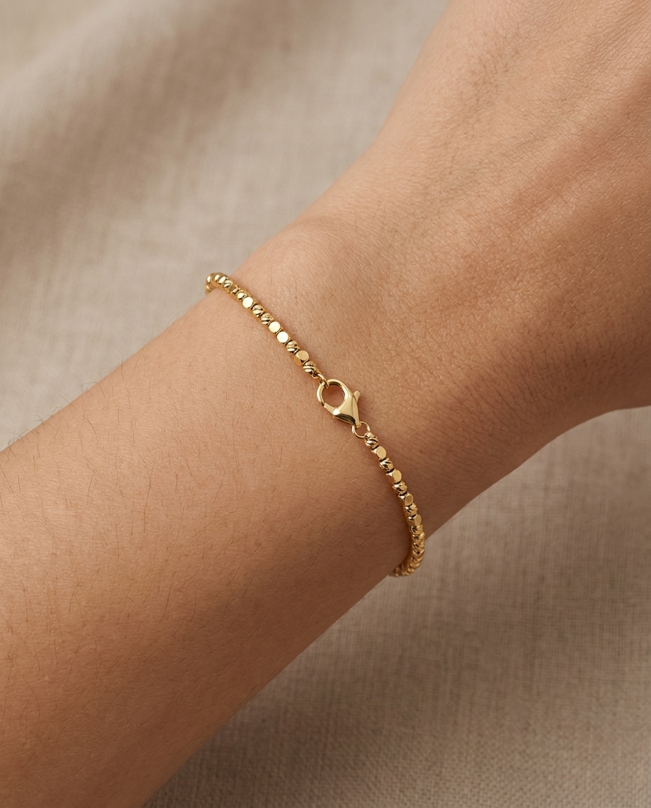 14KT Gold Diamond Cut Beads Bracelet on model