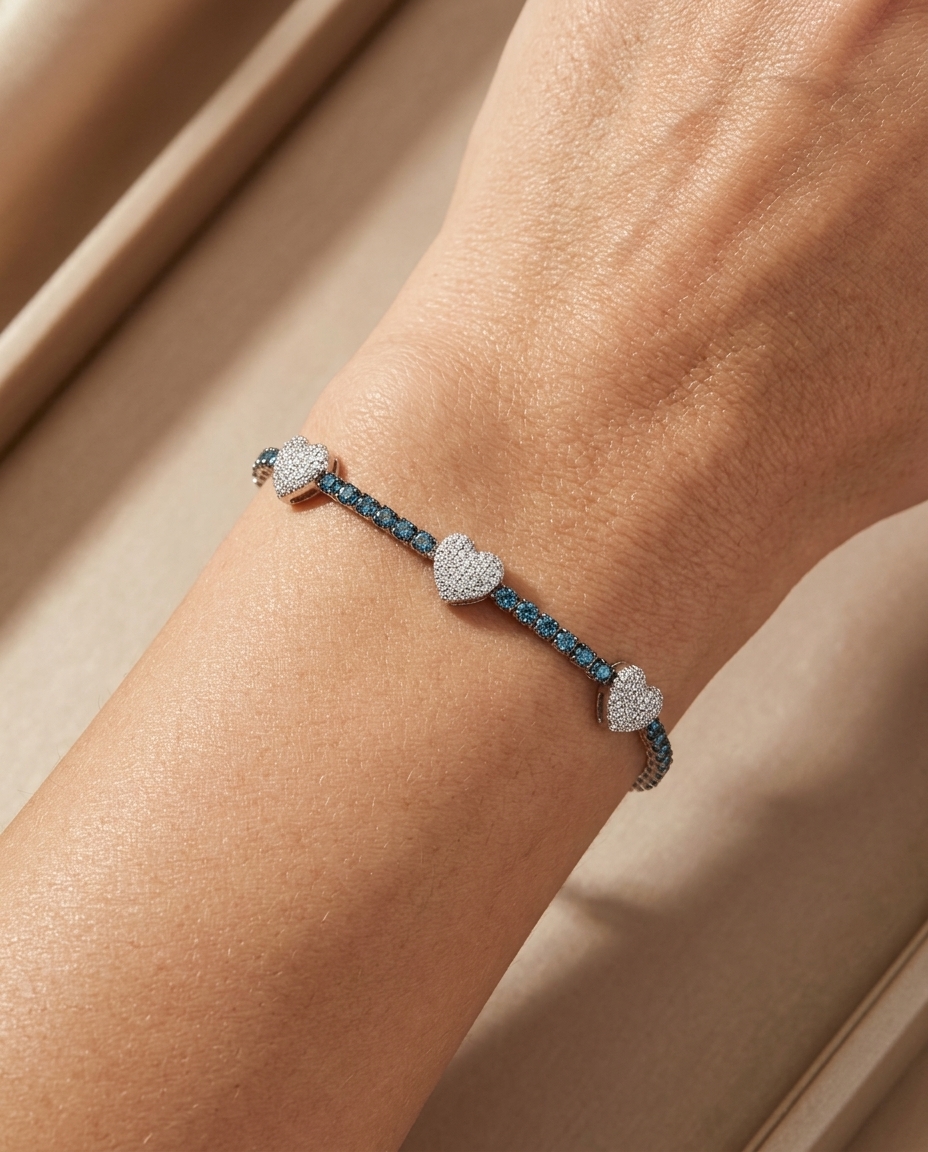 14KT Gold Blue Diamonds and Diamonds Heart Tennis Bracelet on model