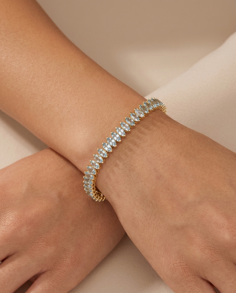 14KT Yellow Gold Marquise Shape Aquamarine Tennis Bracelet on model