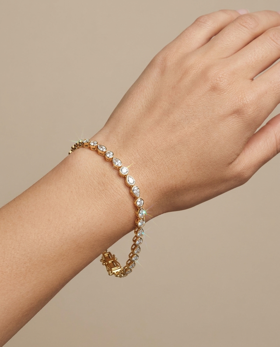14KT Gold Pear Diamond Bezel Tennis Bracelet on model