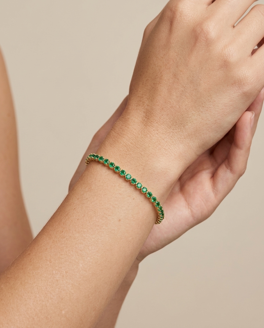 14KT Yellow Gold Emerald Tennis Bracelet on model