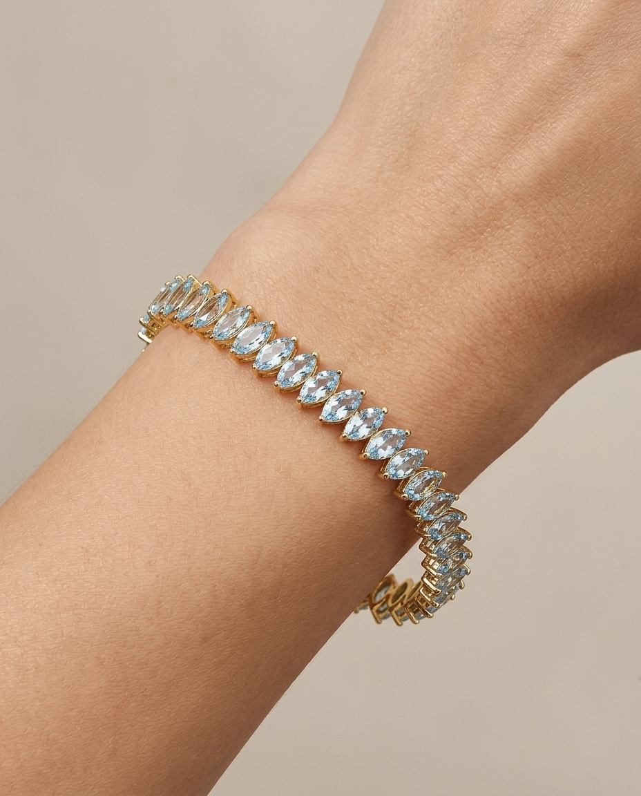 14KT Yellow Gold Marquise Shape Aquamarine Tennis Bracelet on model