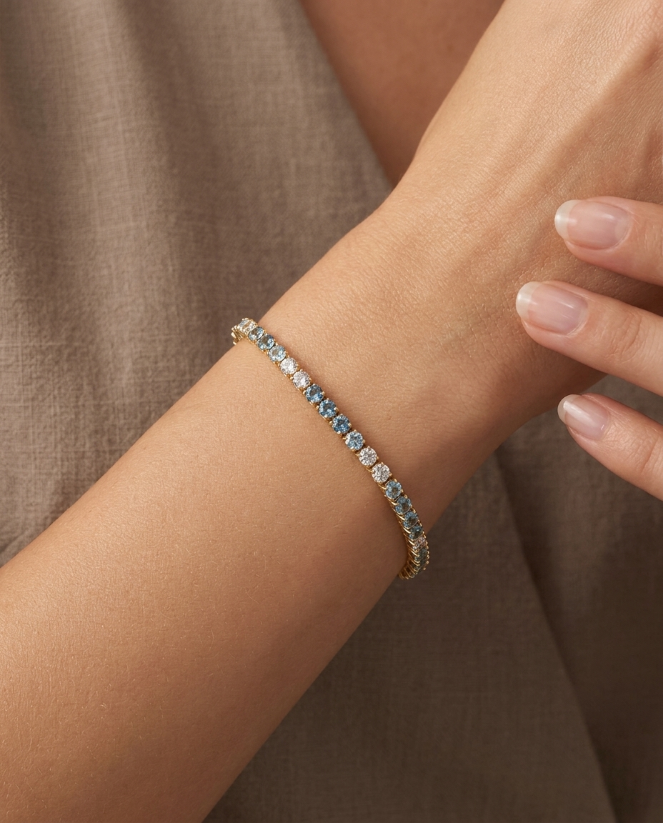 14KT Gold Blue Aquamarine and Diamond Tennis Bracelet on model