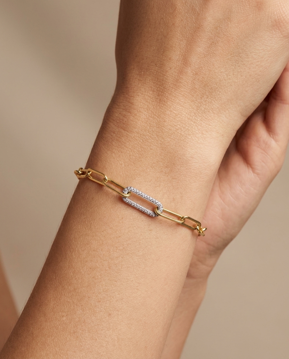 14KT Gold Paperclip Chain with One Diamond Link Bracelet on model