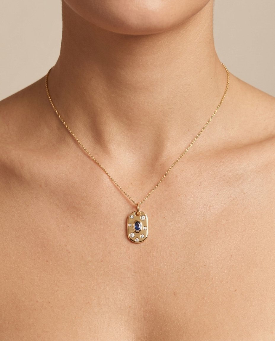14KT Yellow Gold Pendant with Diamonds and Blue Sapphire on model