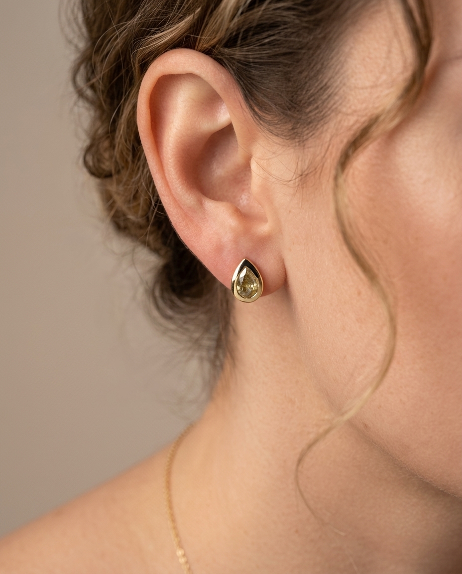 14KT Yellow Gold Pear Diamond Bezel Earring Studs on model