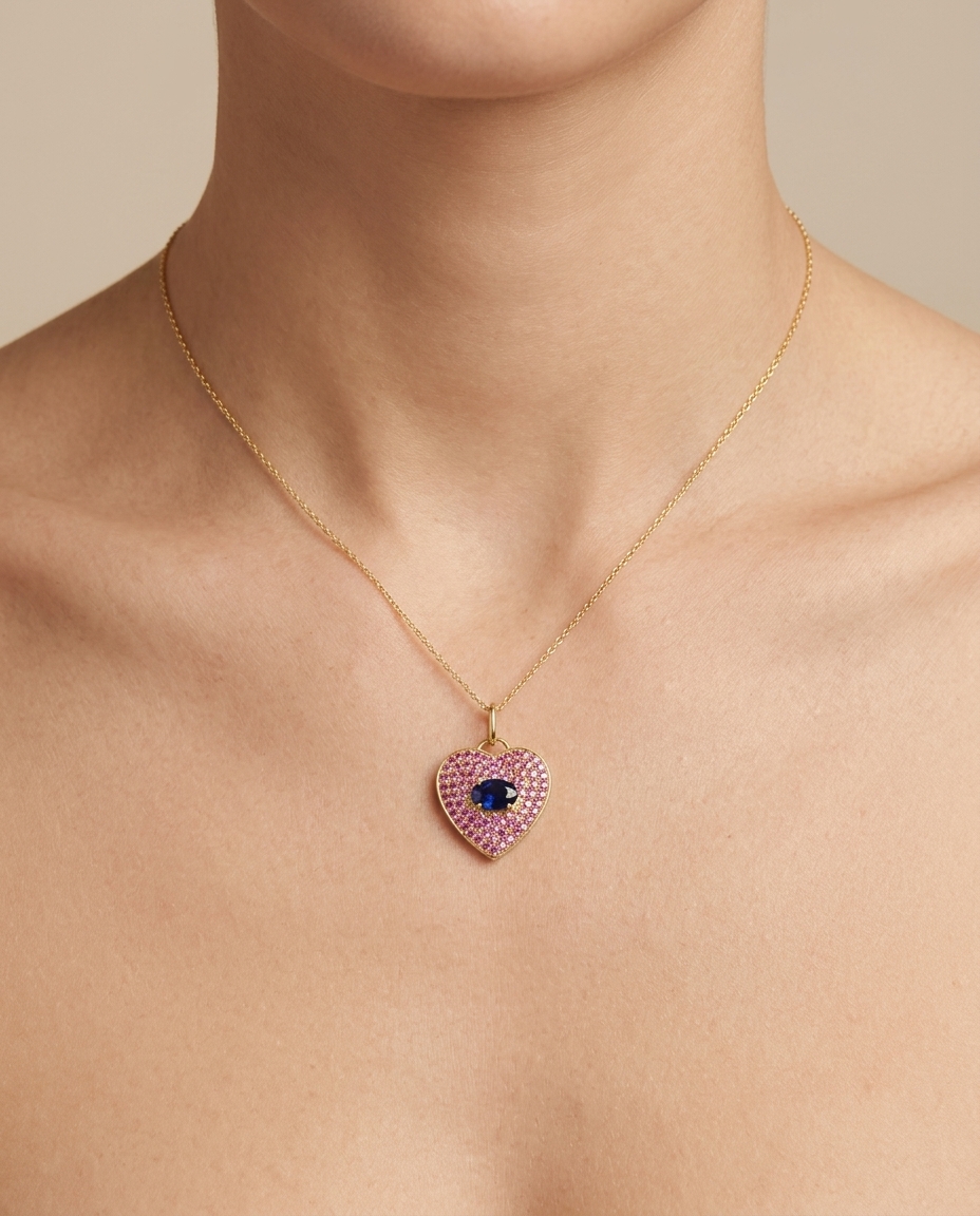 14KT Yellow Gold Pink and Blue Sapphire Heart Pendant on model
