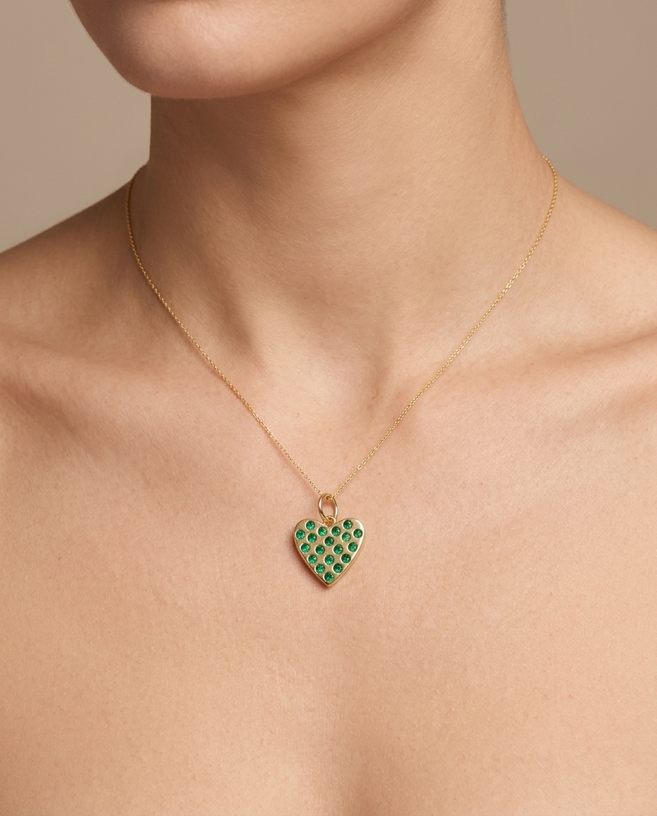 14KT Gold Heart Pendant with Emerald on model