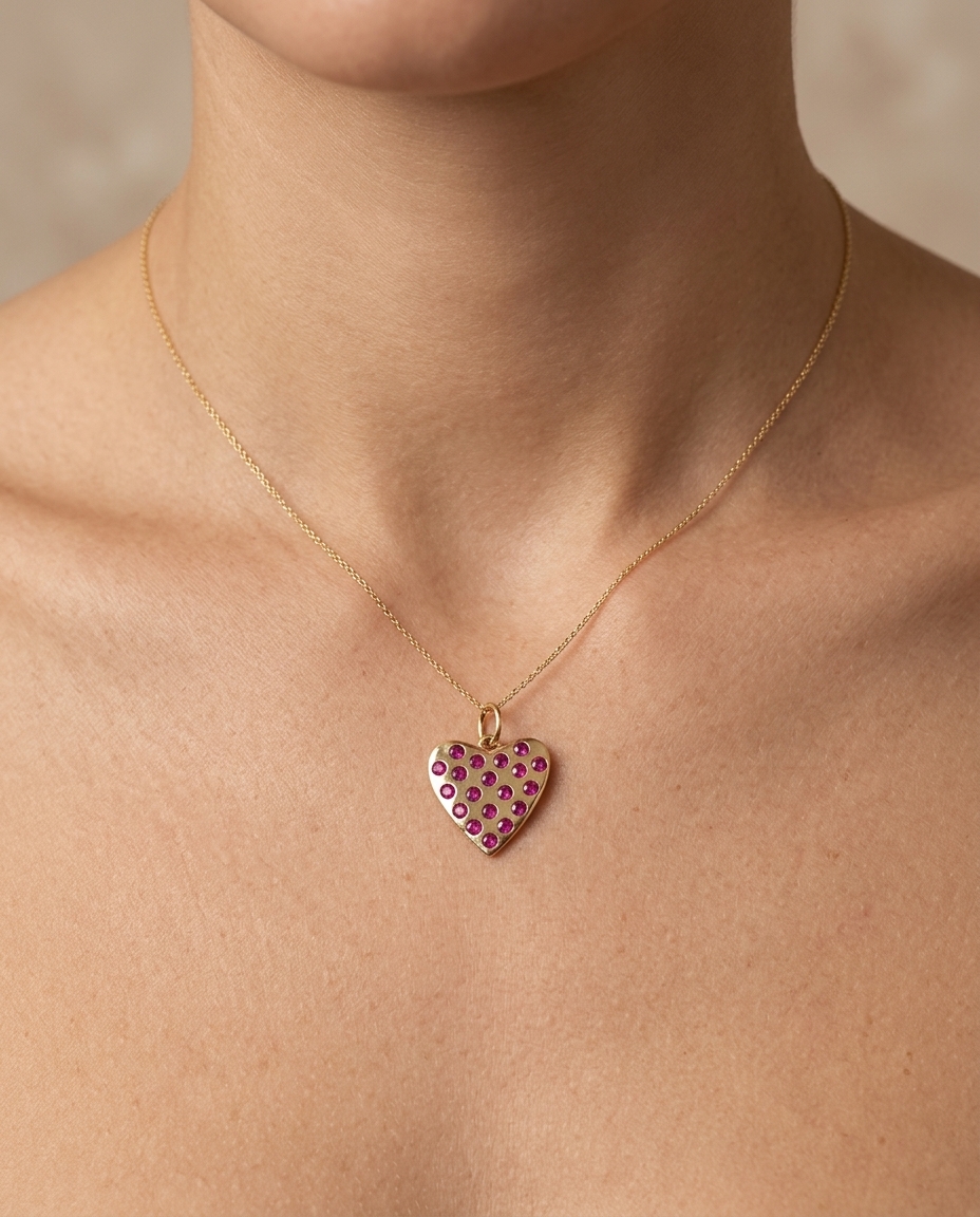 14KT Gold Heart Pendant with Ruby on model