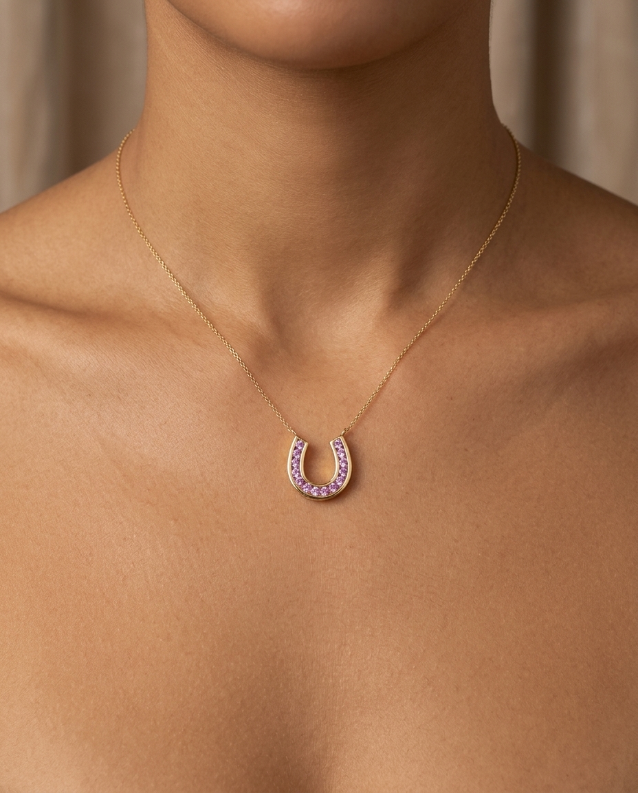 14KT Yellow Gold Horseshoe Pendant with Pink Sapphire on model