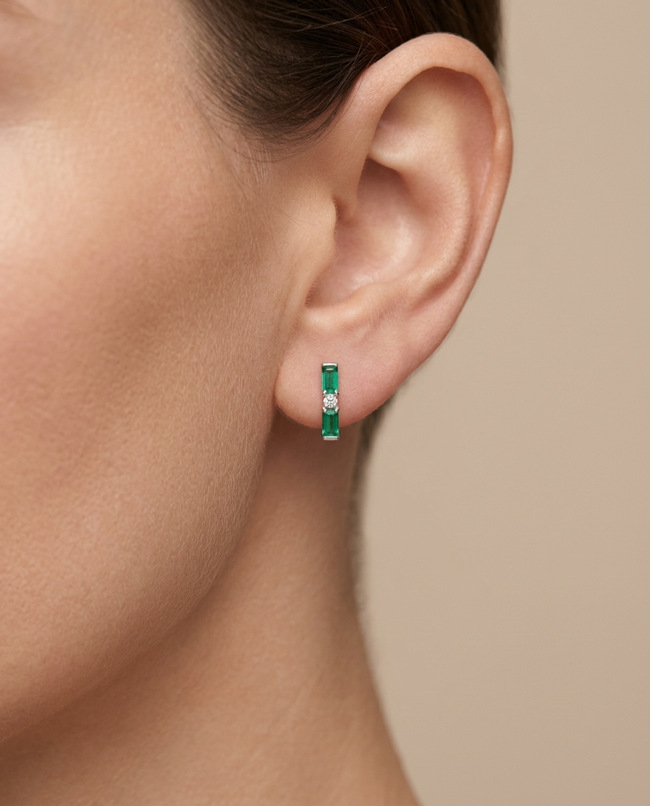 18KT White Gold Emerald and Diamond Earring on model