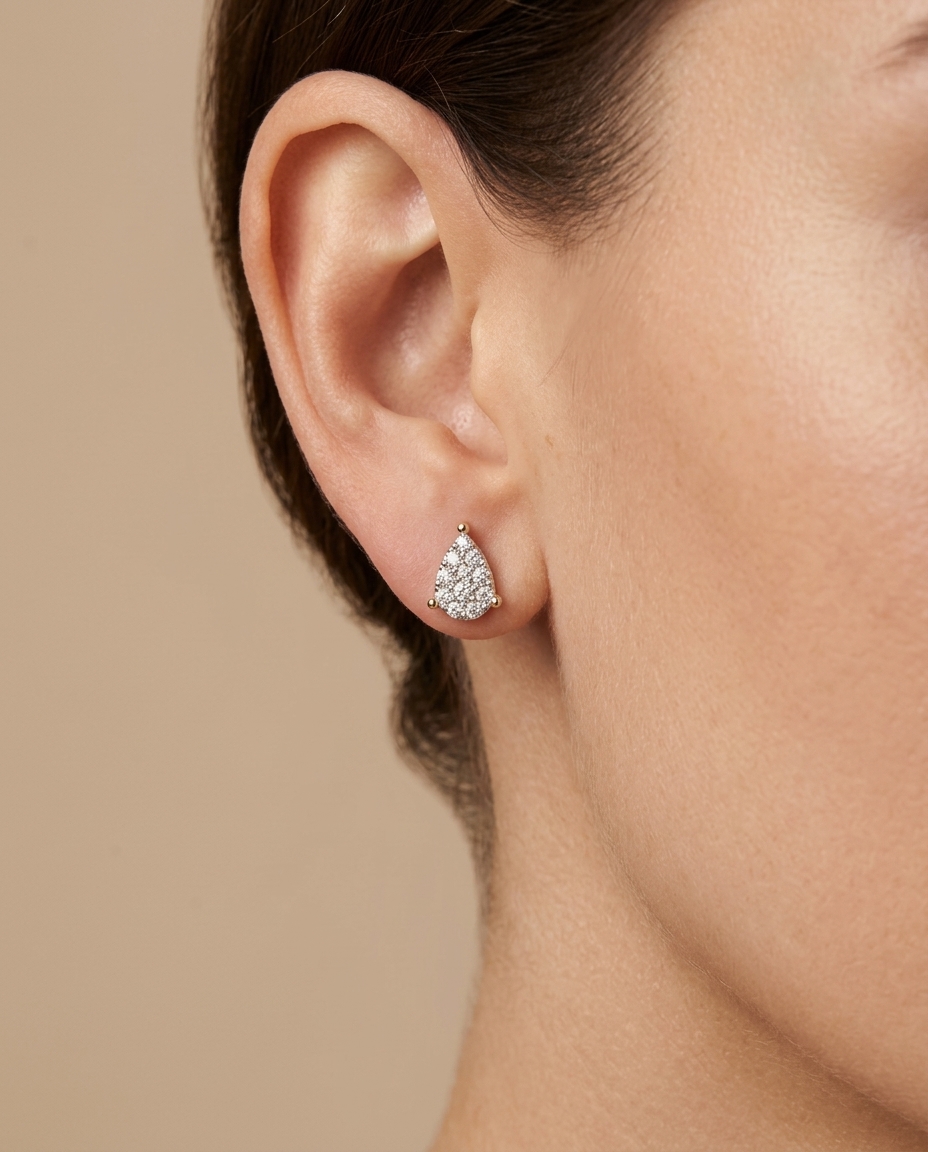 14KT Gold Diamond Pear Shape Earring on model