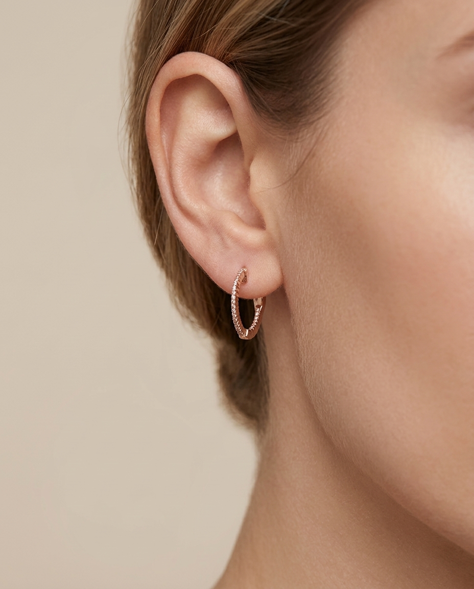 14KT Rose Gold Diamond Huggies Earring on model