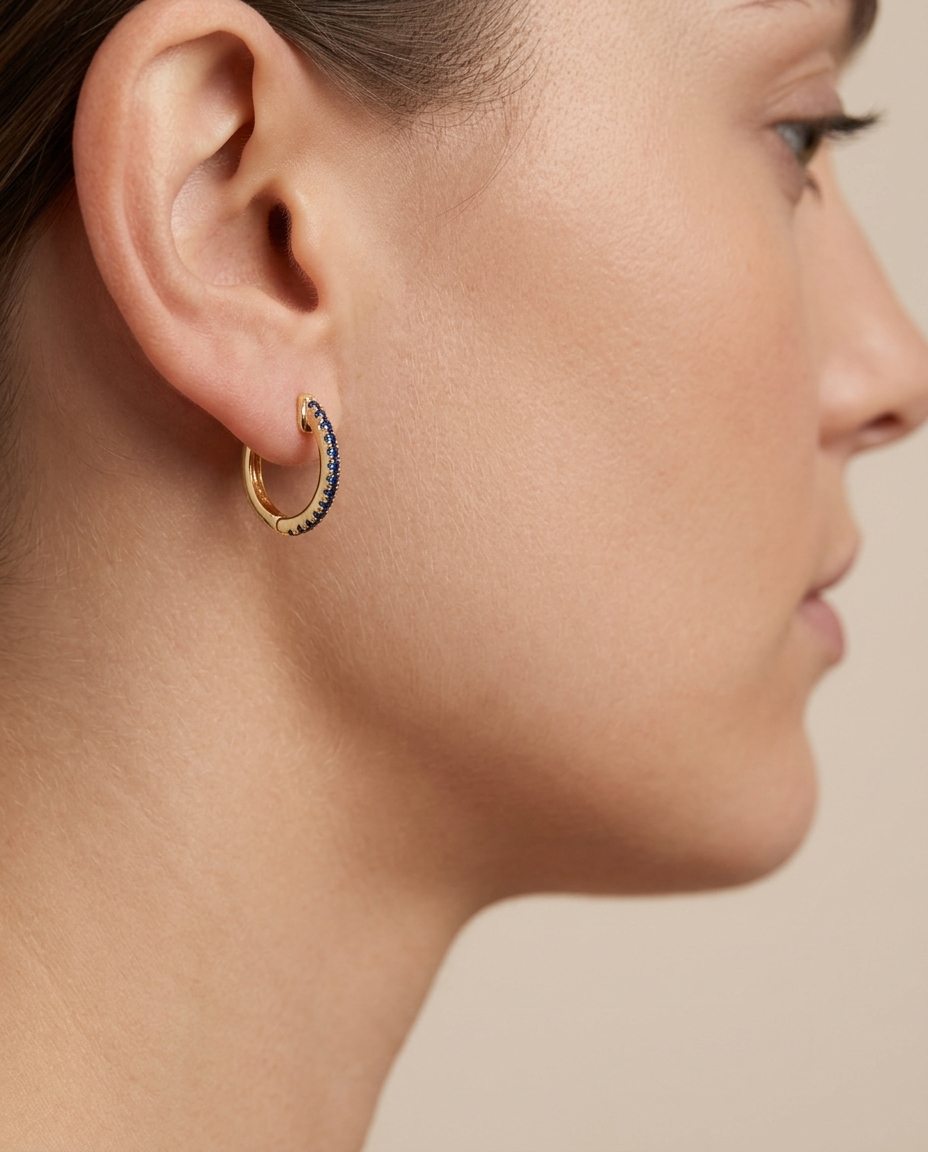 14KT Yellow Gold Blue Sapphire Huggies Earring on model