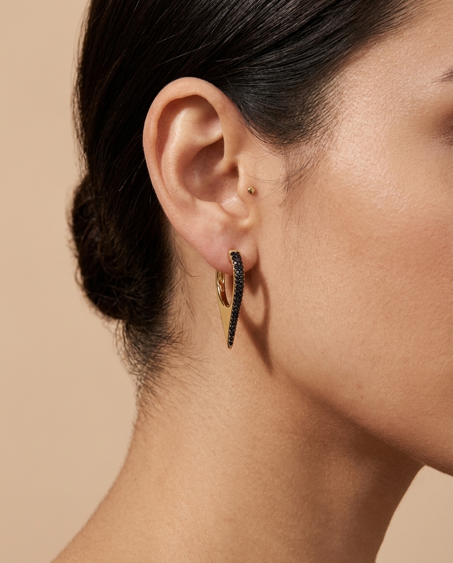 14KT Gold Black Diamond Spike Huggies on model