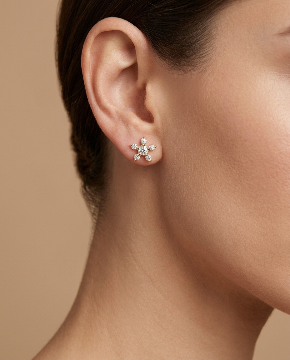 14KT Gold Star / Flower Diamond Earring on model