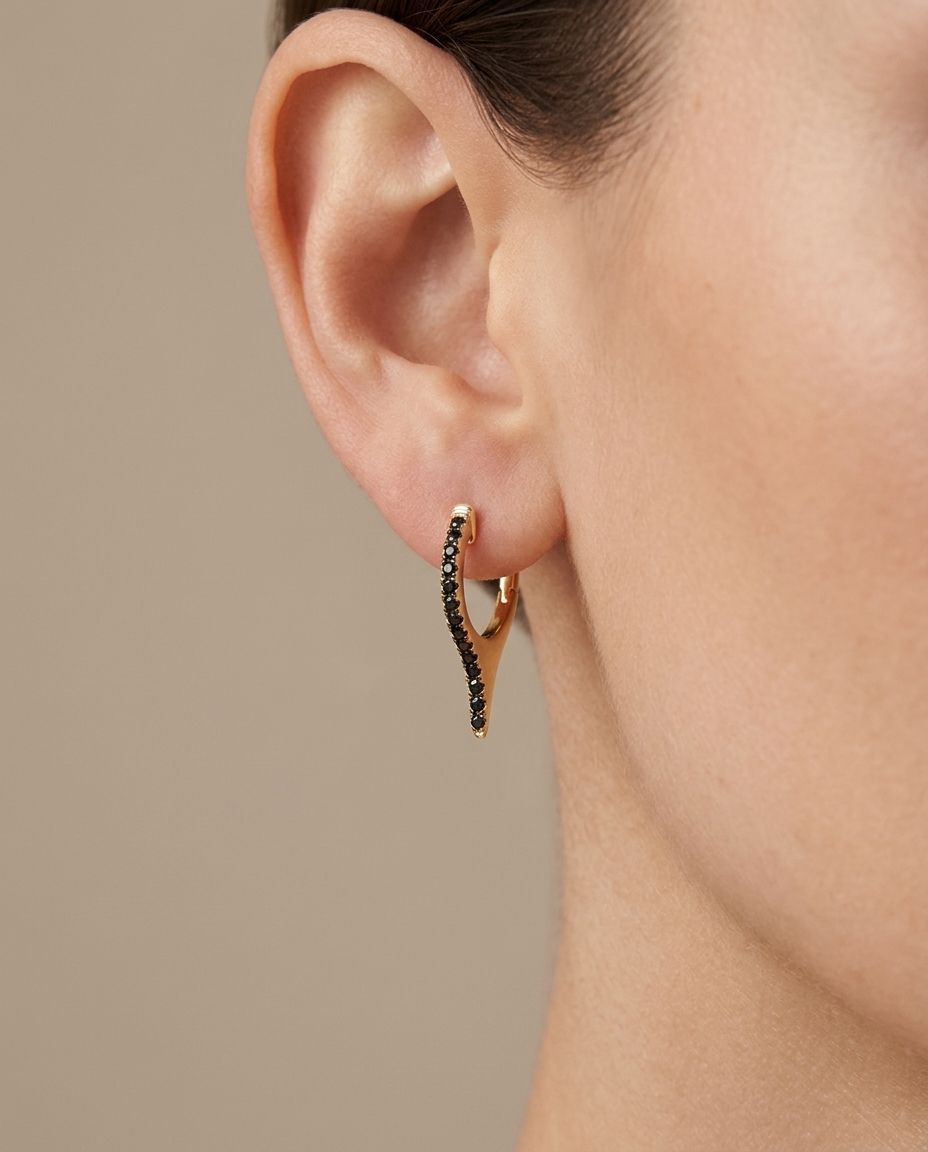 14KT Gold Black Diamond Spike Huggies on model