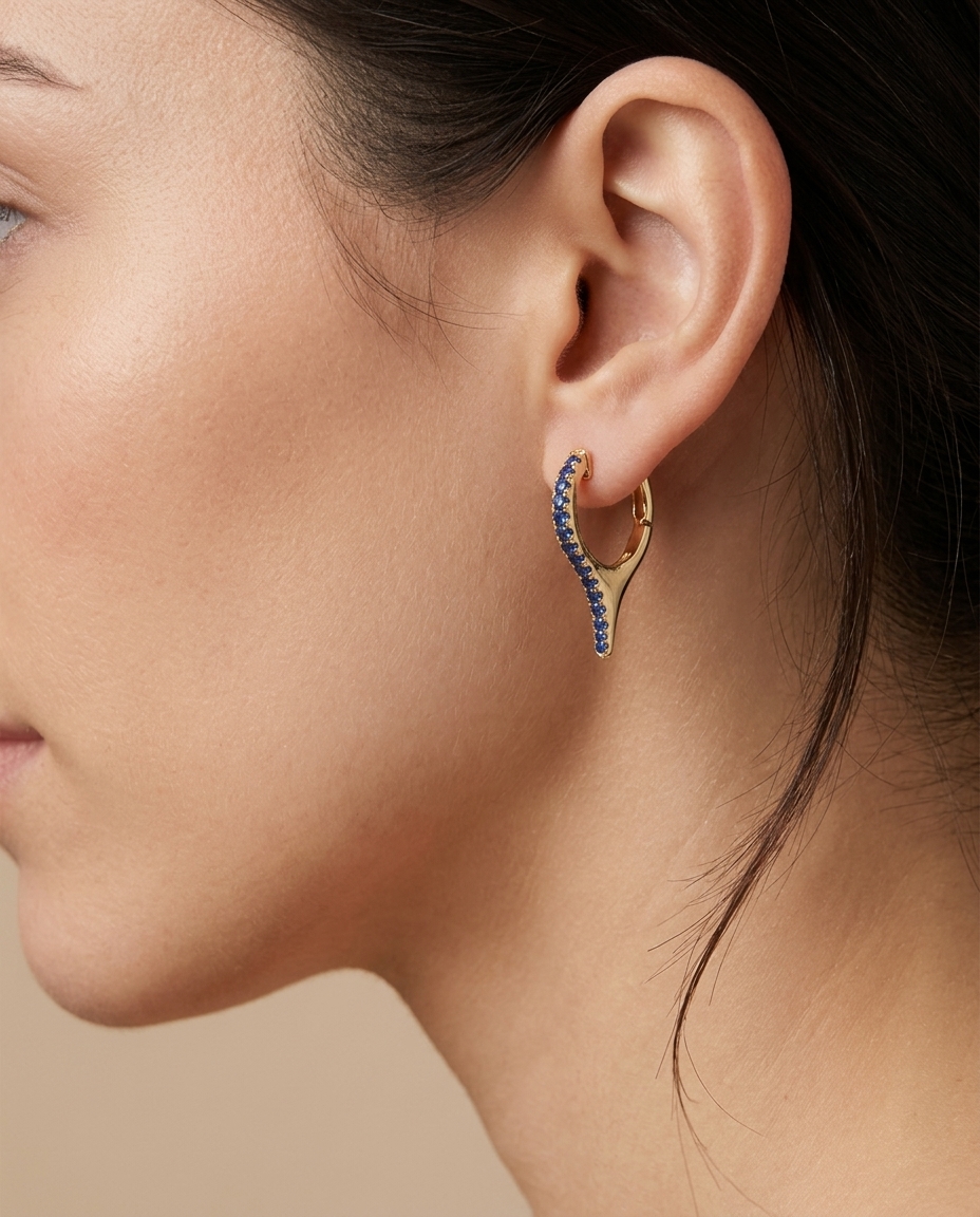 14KT Gold Blue Sapphire Spike Huggies on model