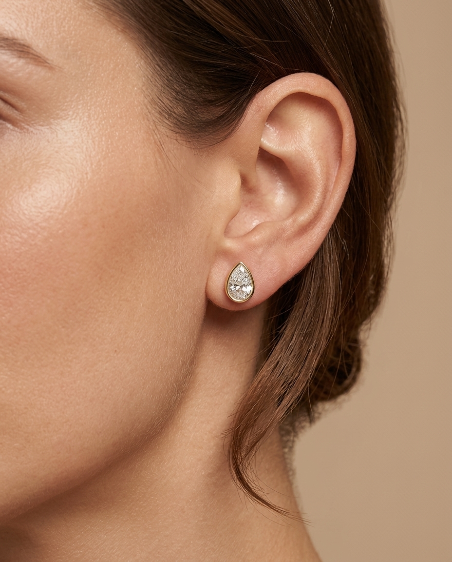 14KT Gold Tear Drop Diamond Bezel Set Earring on model