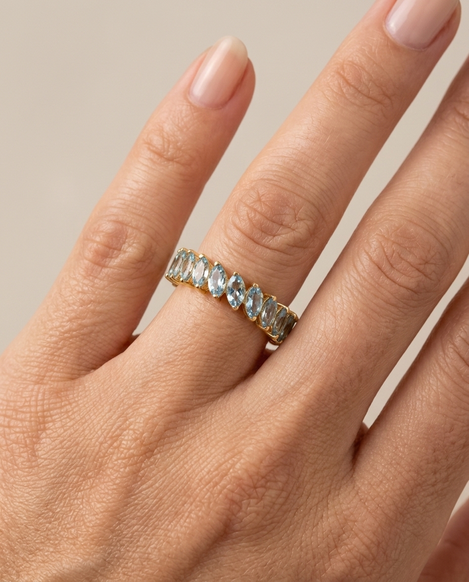 14KT Yellow Gold Marquise Shape Aquamarine Eternity Band on model