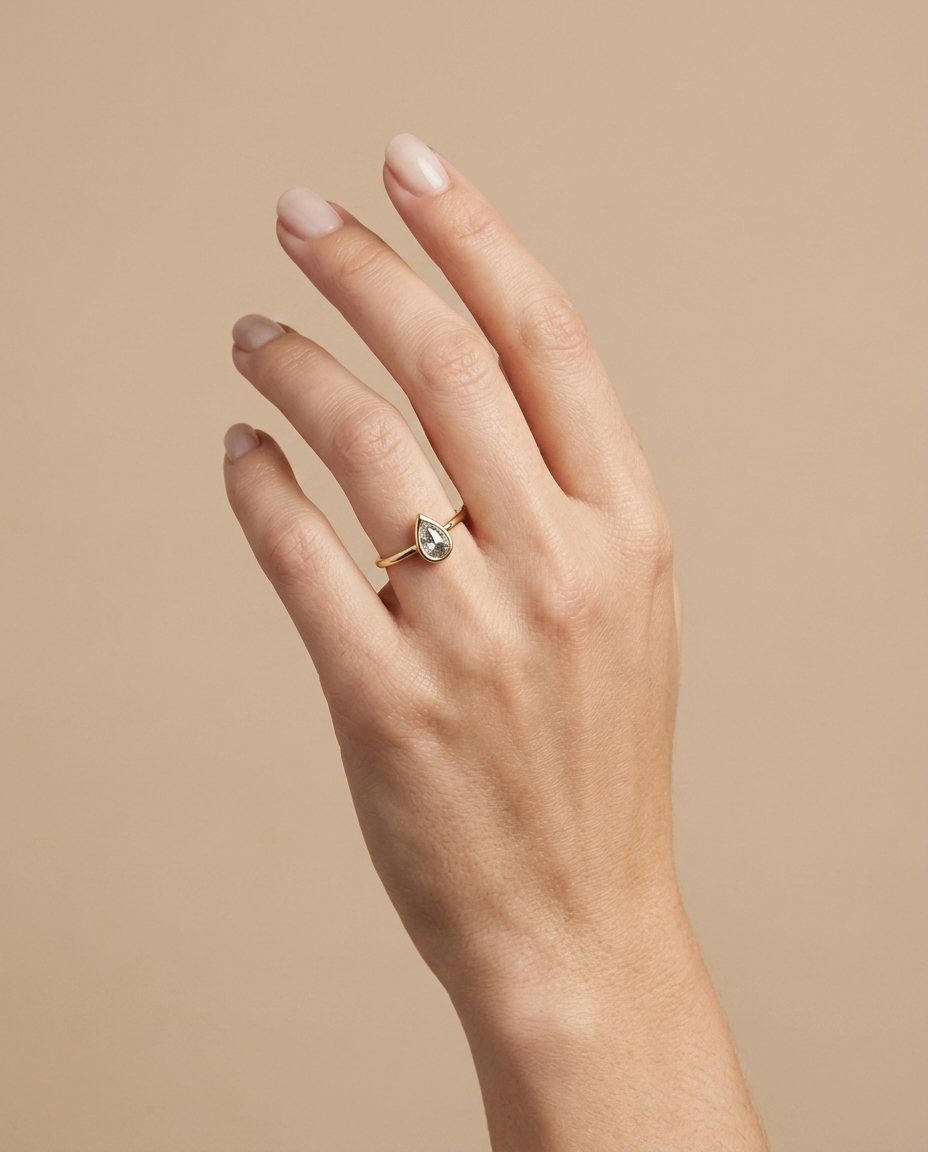 14KT Gold Ring with Single Bezeled Pear Shape Diamond view 2