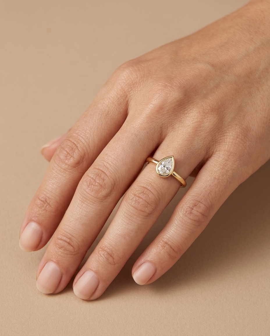14KT Gold Ring with Single Bezeled Pear Shape Diamond view 2
