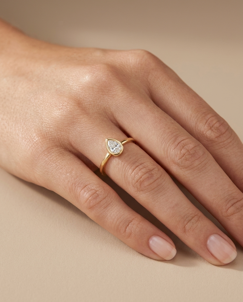 14KT Gold Ring with Single Bezeled Pear Shape Diamond view 2