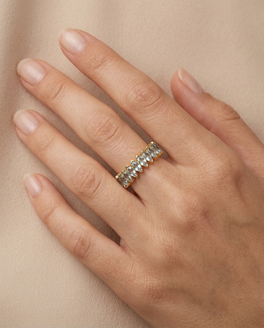 14KT Gold Marquise Shape Aquamarine Eternity Band on model
