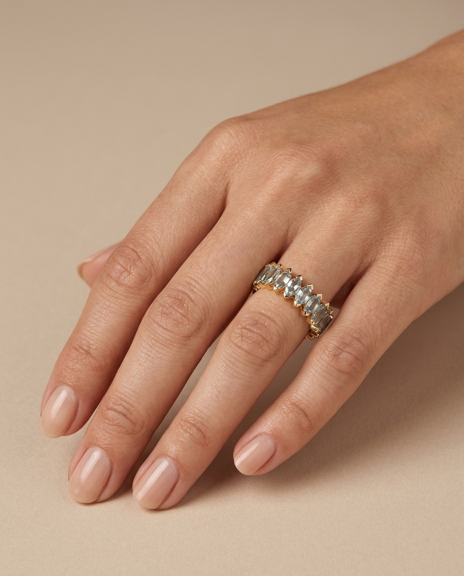14KT Gold Marquise Shape Aquamarine Eternity Band on model