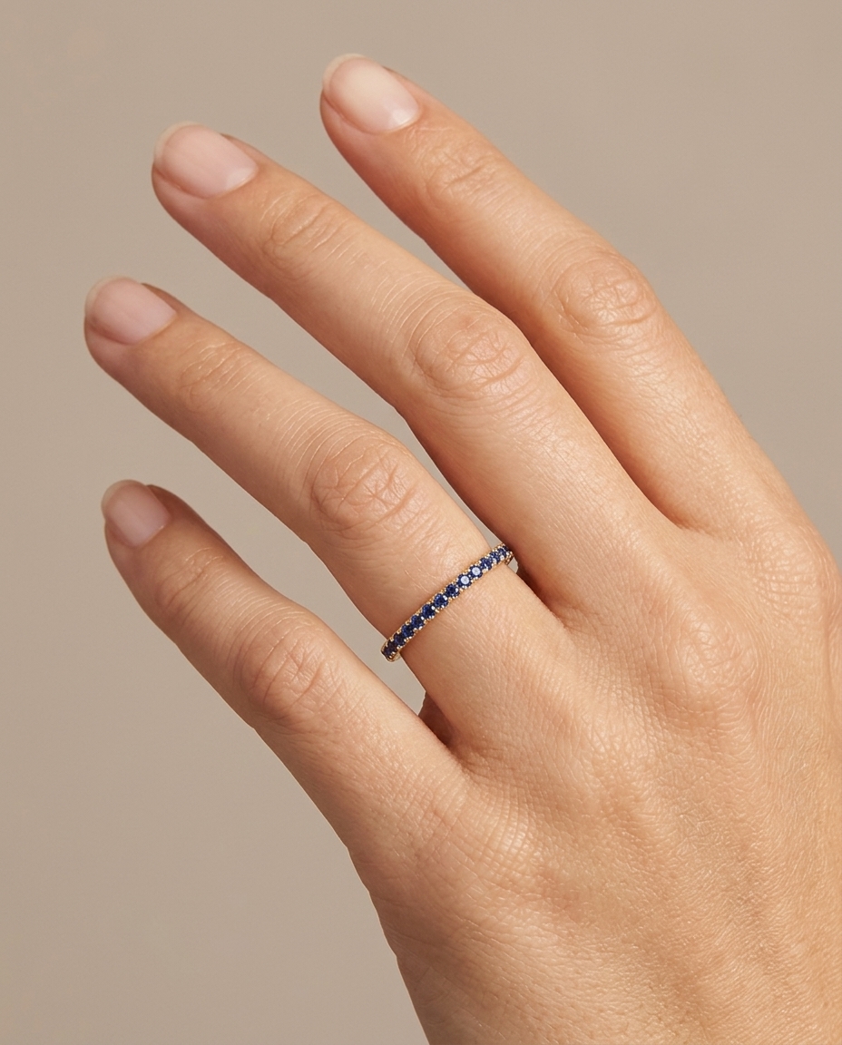 14KT Gold Blue Sapphire Ring Eternity Band on model