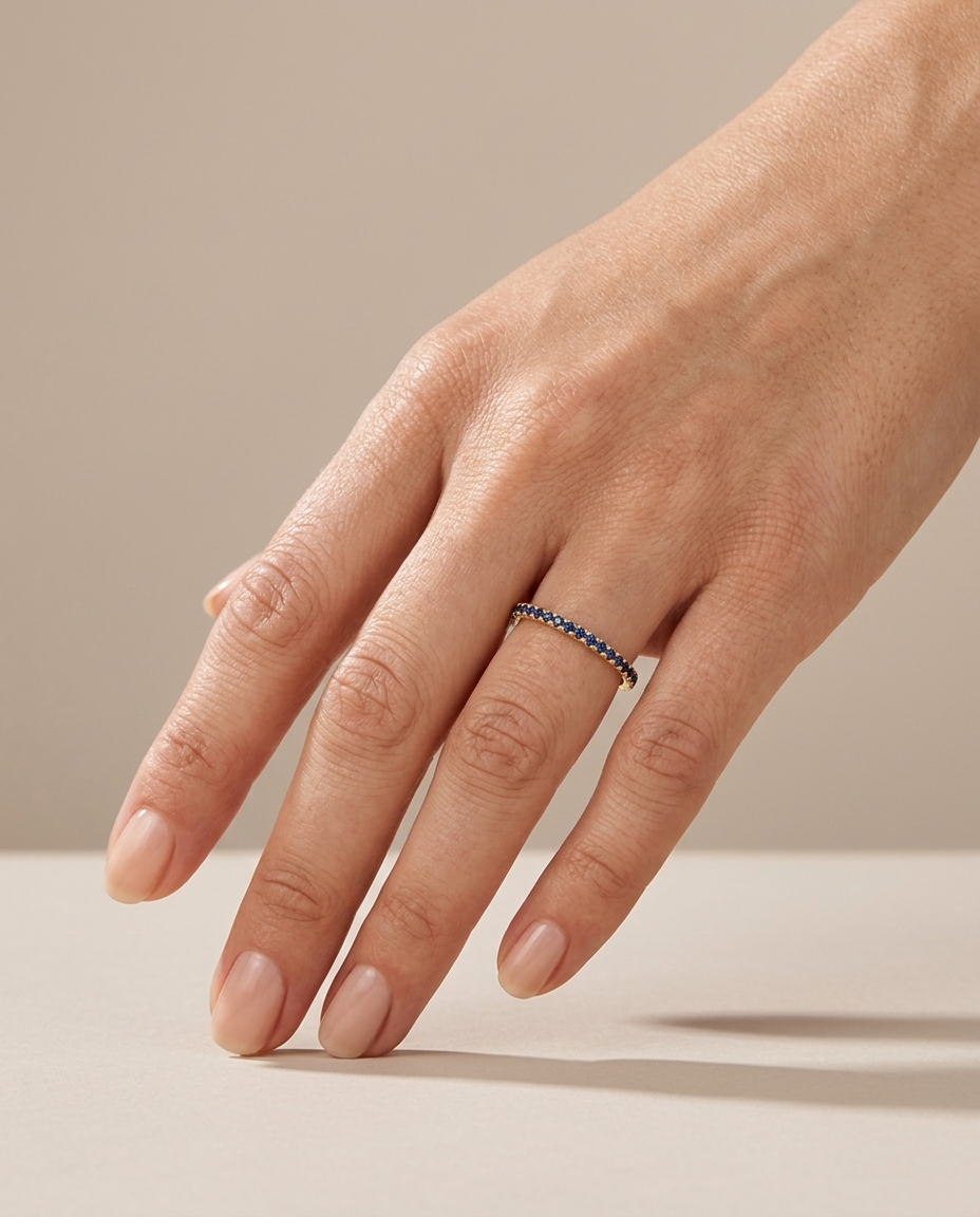 14KT Gold Blue Sapphire Ring Eternity Band on model