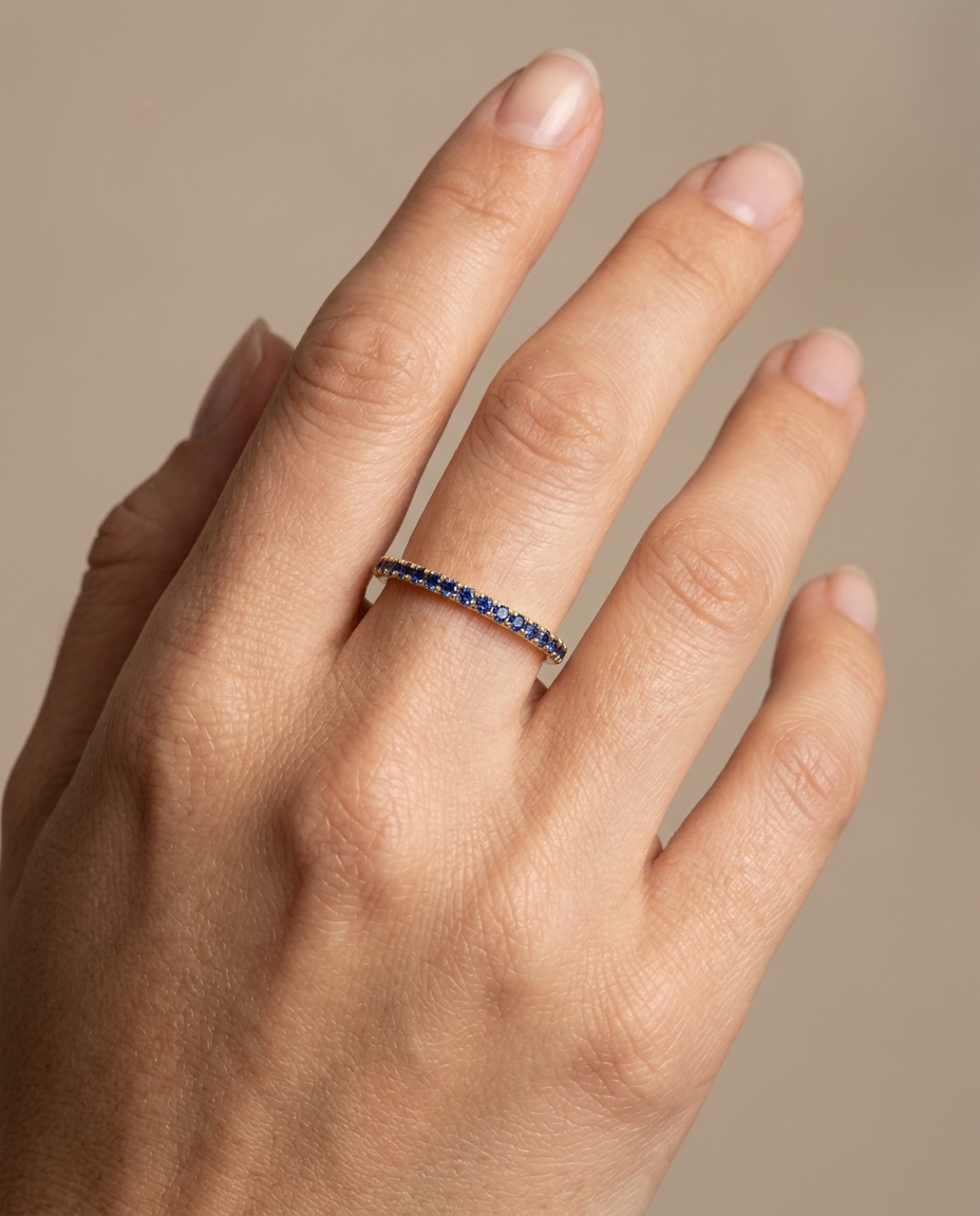 14KT Gold Blue Sapphire Ring Eternity Band on model
