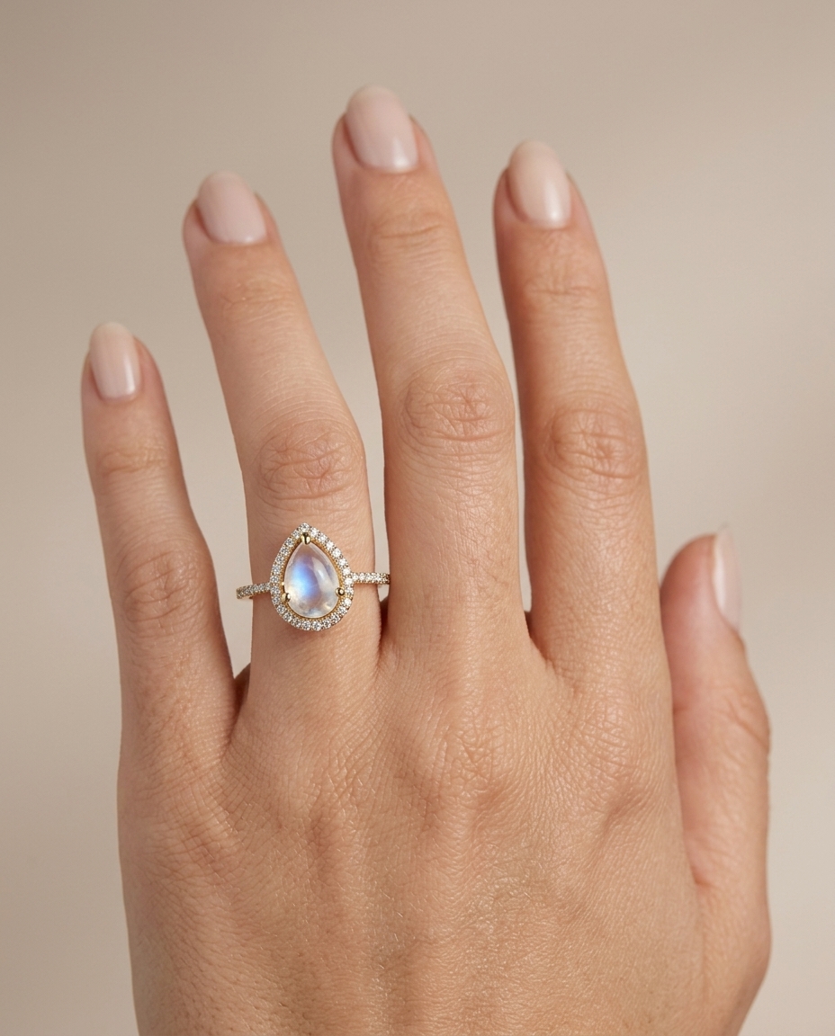 14KT Yellow Gold Rainbow Moon Stone Pear Shape Ring with Diamonds on model