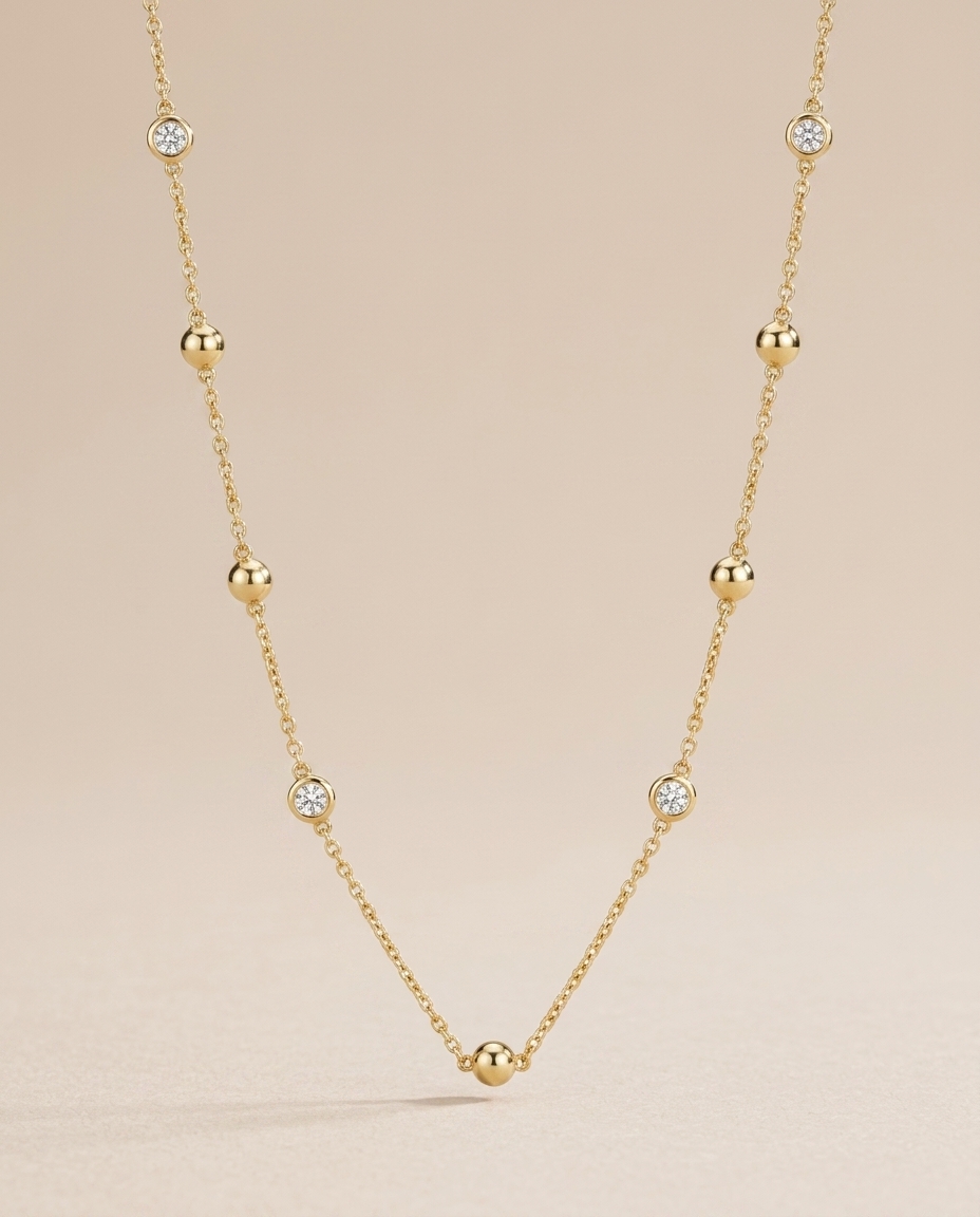 14KT Gold Bezelled Diamond Station Necklace on model