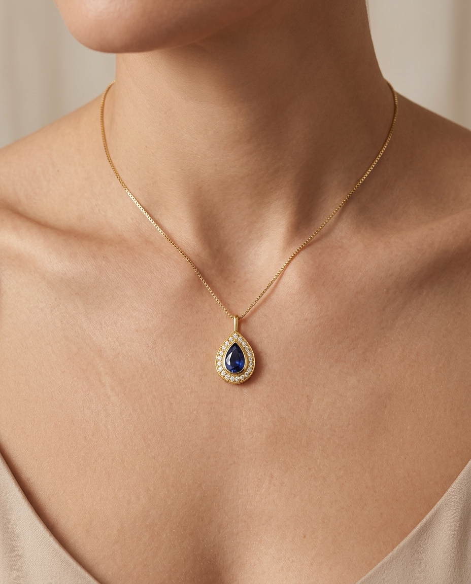 14KT Yellow Gold Blue Sapphire Pear Pendant on model