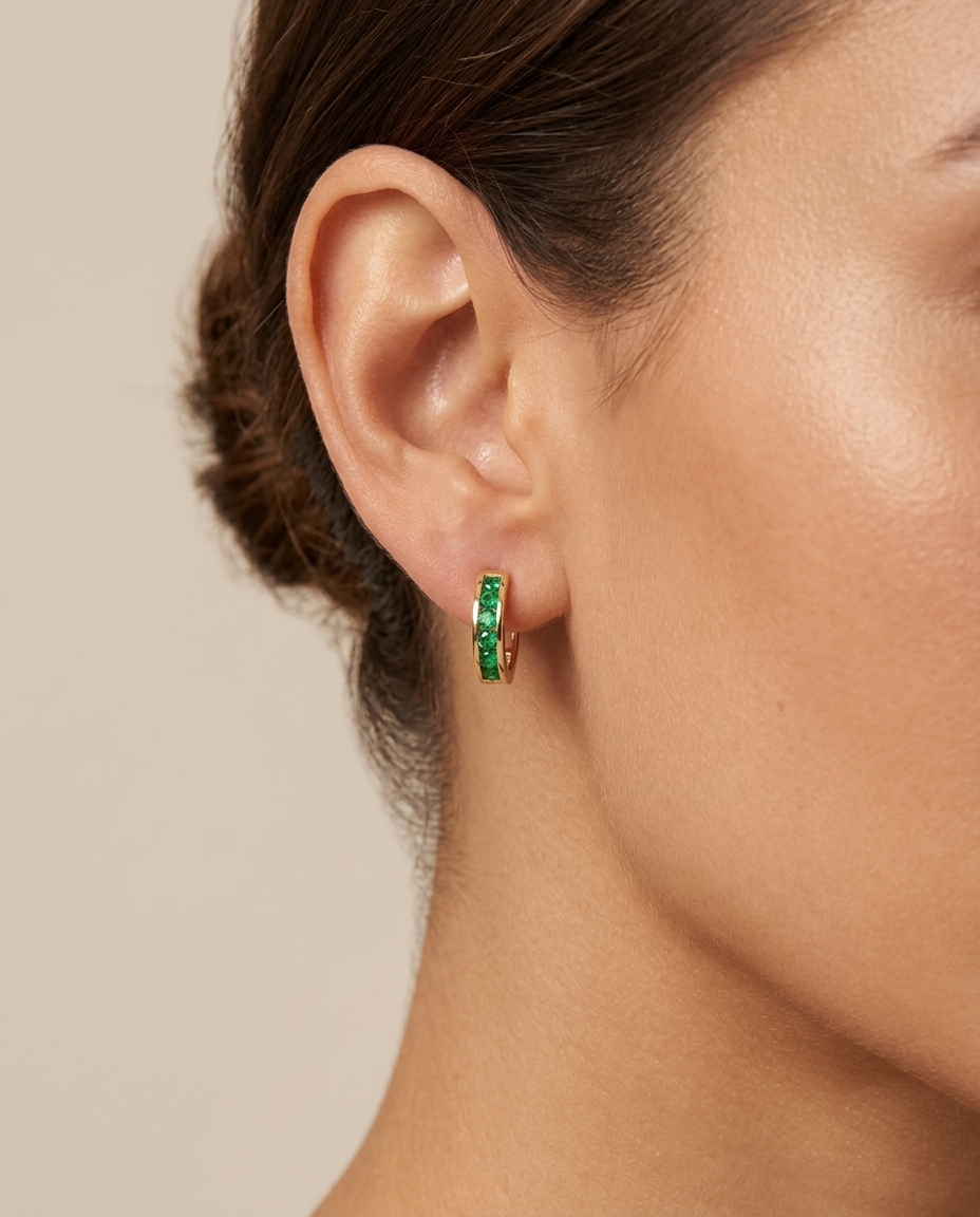 14KT Yellow Gold Emerald Huggies Earring on model
