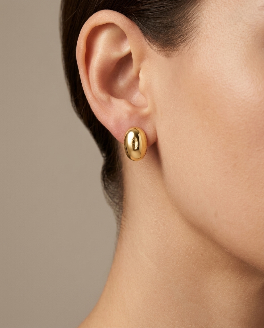 14KT Italian Yellow Gold Oval Dome Studs on model