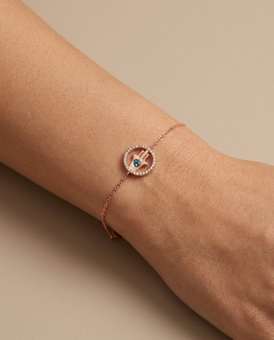 Blue and White Hamsa Bracelet in Rose Gold on model