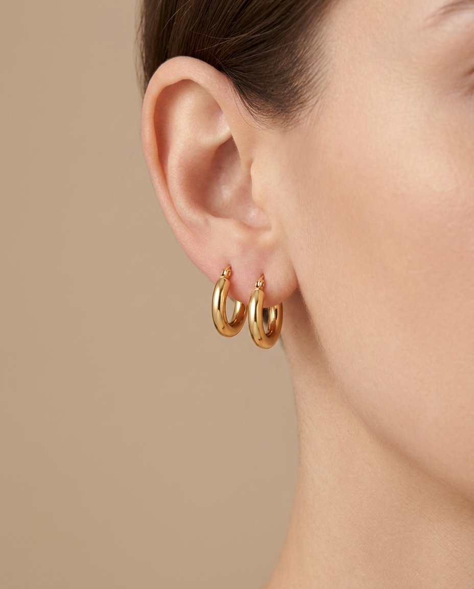 Plain Huggies Earring in Yellow Gold on model