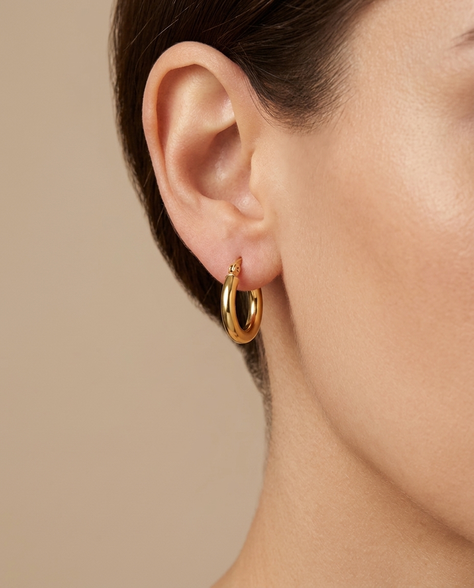 Plain Huggies Earring in Yellow Gold on model
