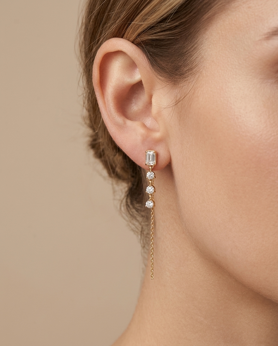 Emerald Diamond Cut Earring with Dangling Three Diamond Chain in Yellow Gold on model