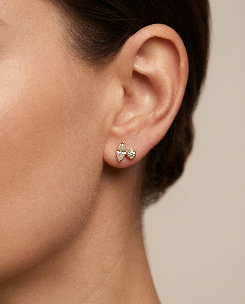 Bezeled Diamond & Marquise Stud . in Yellow Gold on model