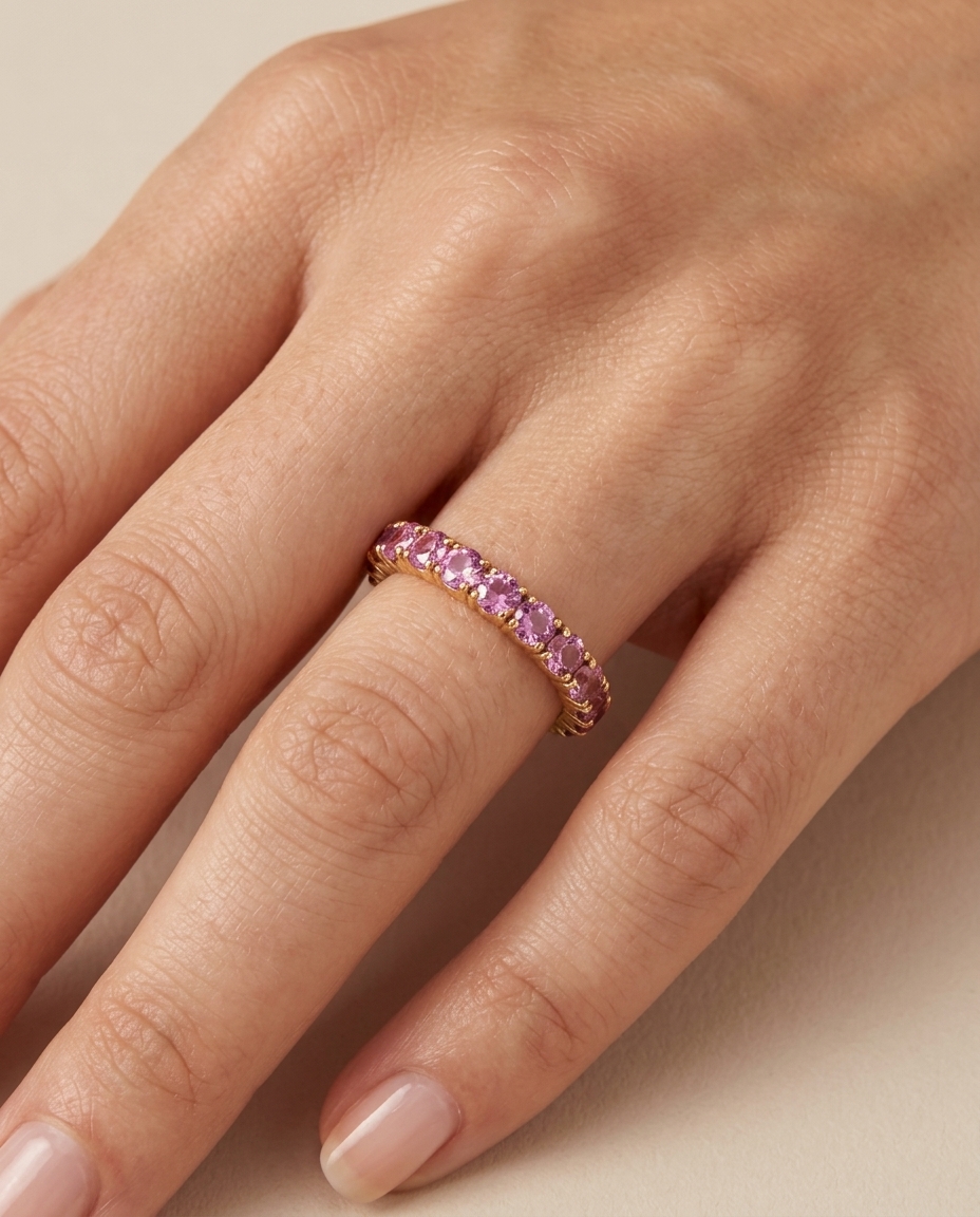 Half Diamond and Half Pink Sapphire Eternity Band in Yellow Gold on model