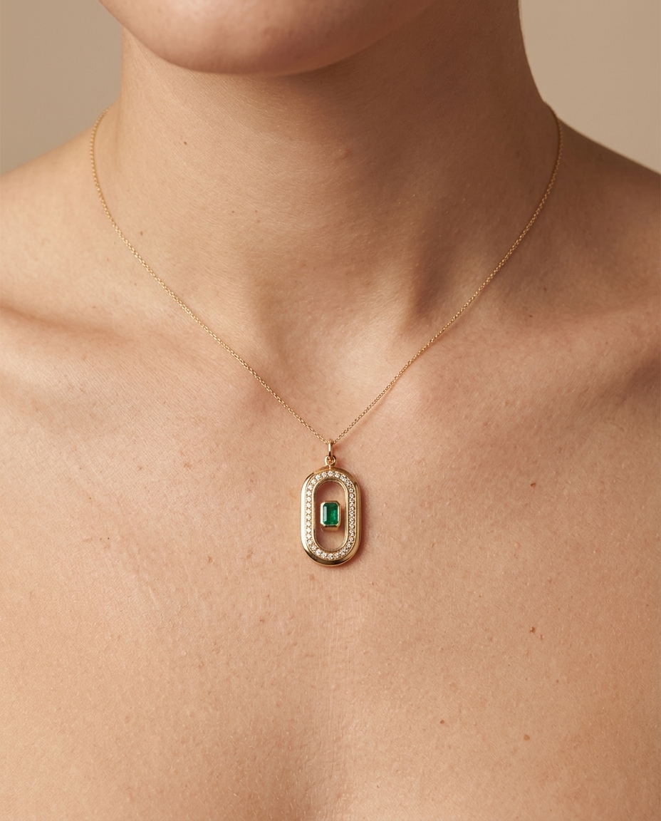 Clear Quartz Pendant with Emerald in Yellow Gold on model
